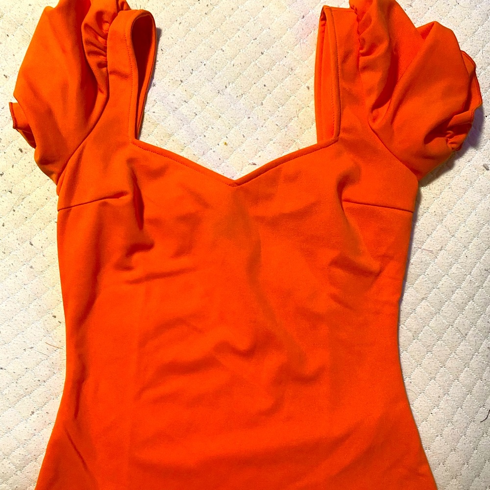 Bright orange top